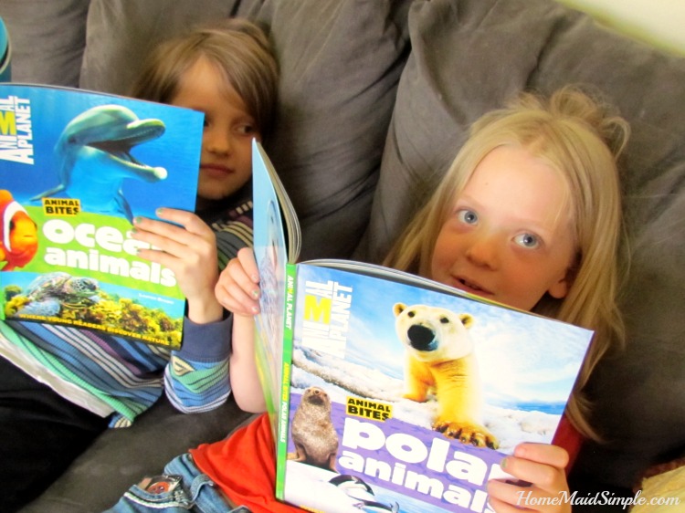 Happy kids reading Amimal Planet Animal Bites books