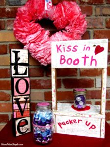 Take a guess and win some kisses with this DIY Kissing Booth.