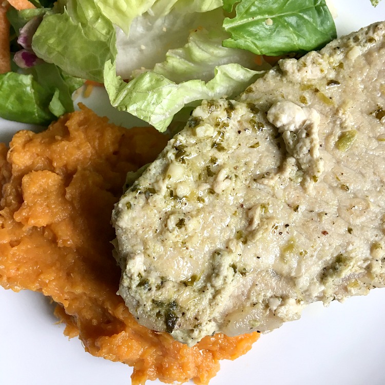 Braised pork chops in garlic butter and basil